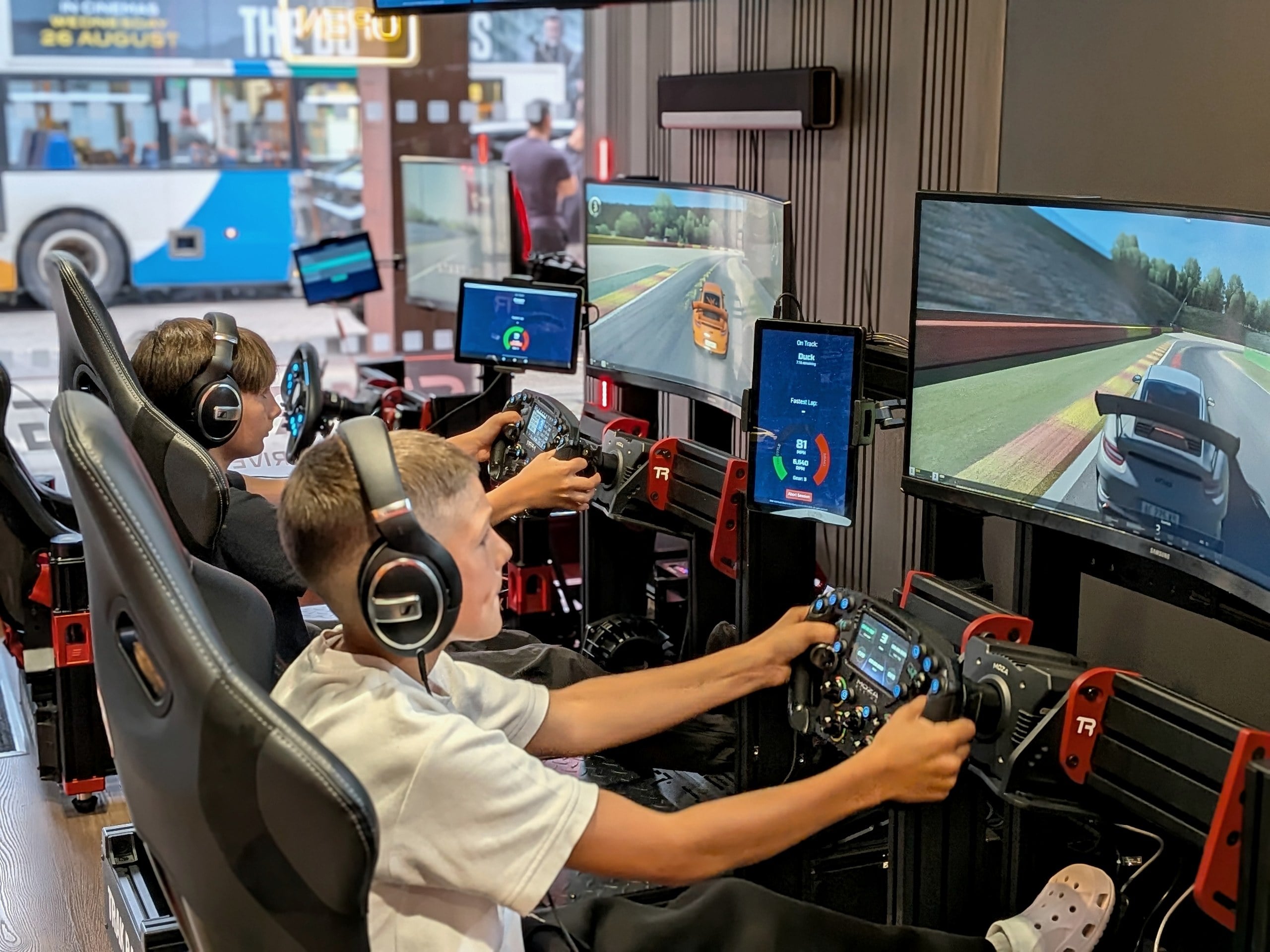 Young drivers racing side by side at a birthday party